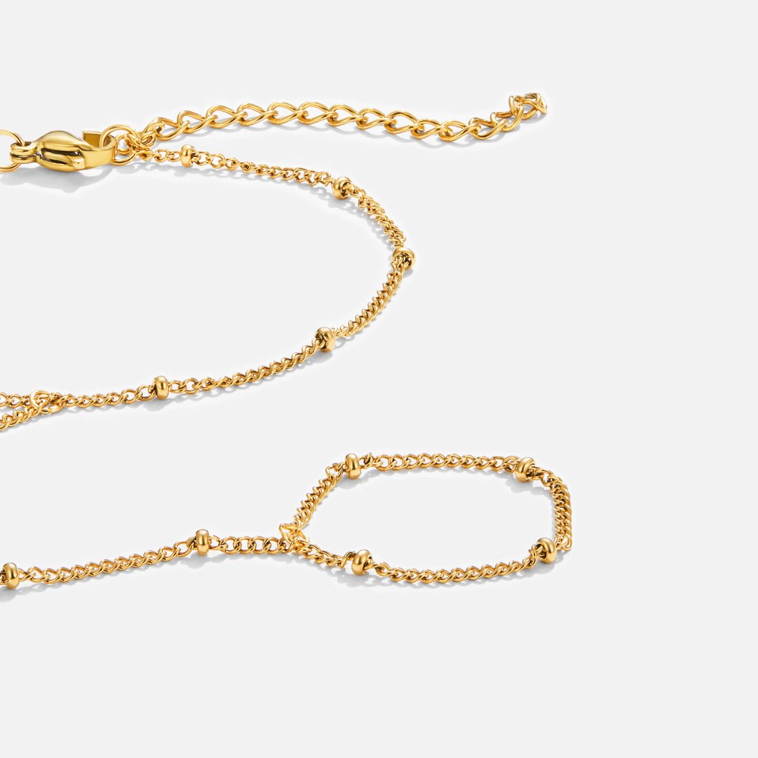 Draped Gold-Tone Hand Chain Bracelet
