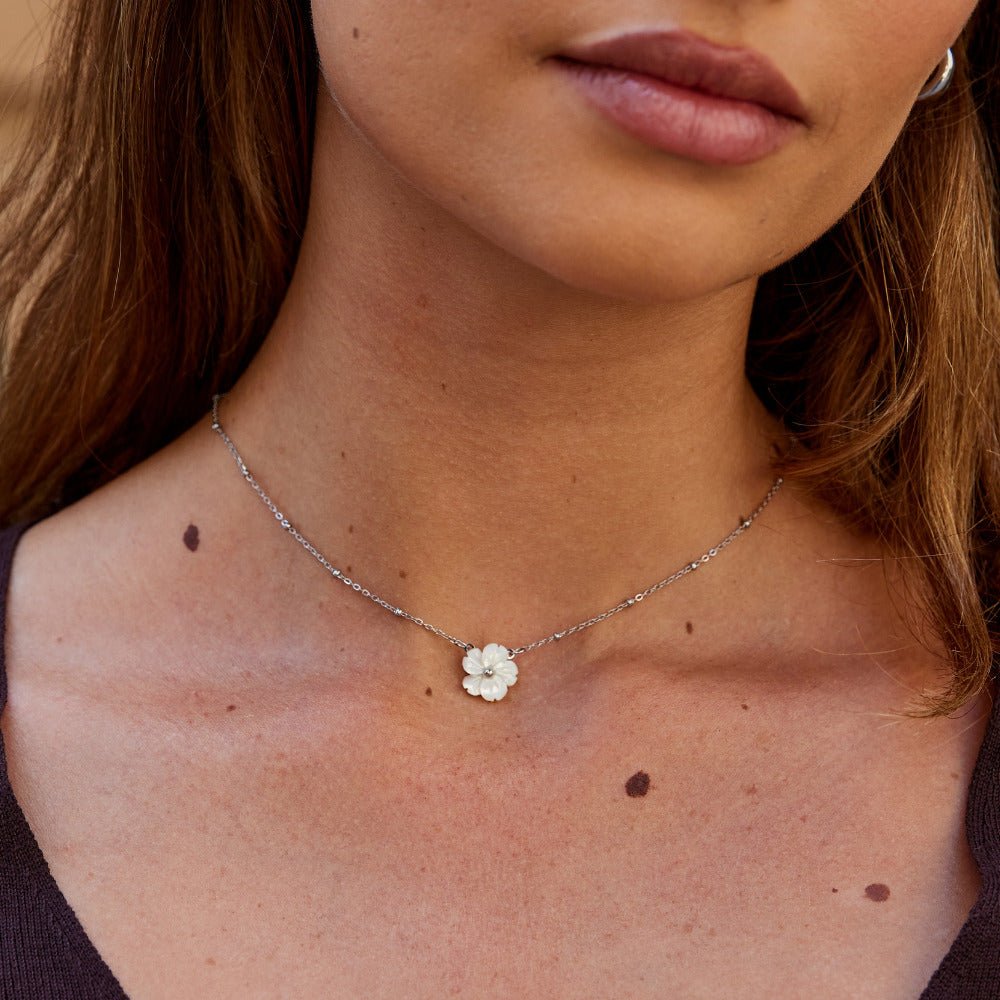 White Blossom Charm on a Silver-Tone Chain Necklace