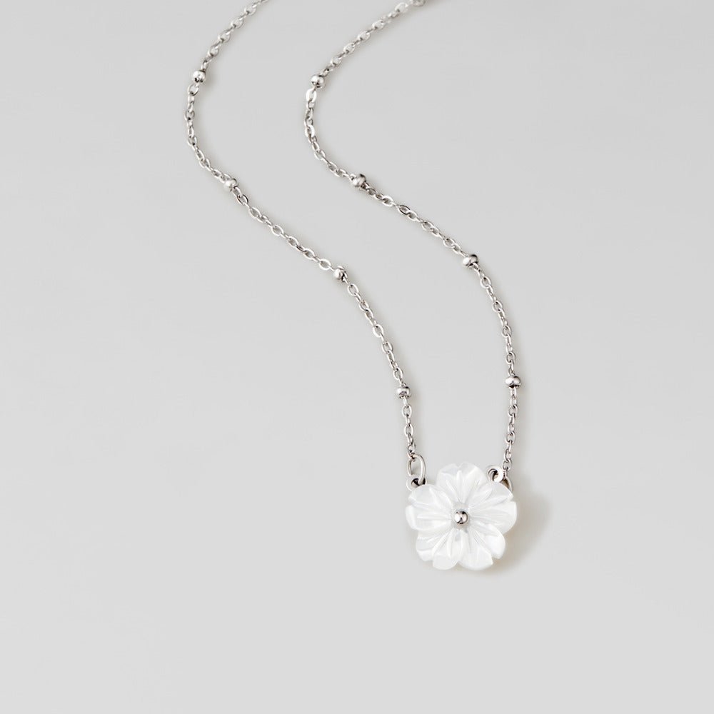White Blossom Charm on a Silver-Tone Chain Necklace
